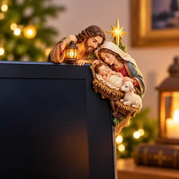 Nativity style with Mary, Joseph, the baby Jesus in a manger, a lamb and a Christmas star, peeking from the screen corner